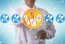 Unrecognizable pharma research scientist selecting the only set of drugs personalized by genome sequencing in a lineup of pills and tablets. Healthcare concept for pharmacogenomics, pharmacogenetics.